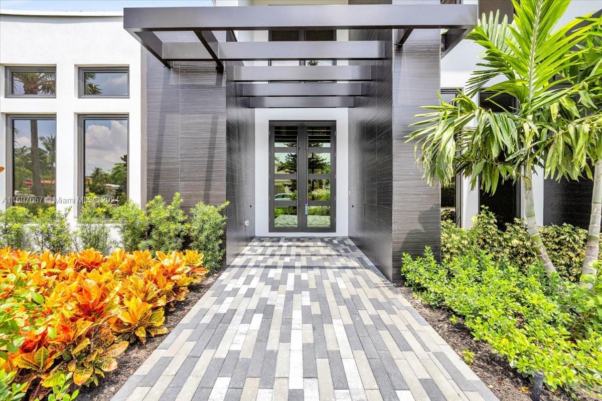 751 Northeast 2nd Street Boca Raton, FL 33432 - Photo 4 of 56 a front view of a house with garden