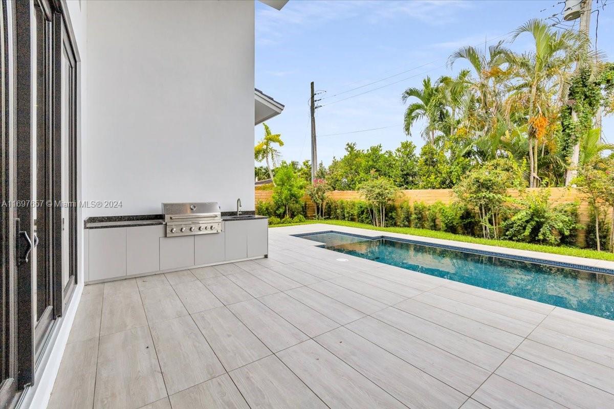 751 Northeast 2nd Street Boca Raton, FL 33432 - Photo 49 of 56 a view of kitchen with cabinets and outdoor space