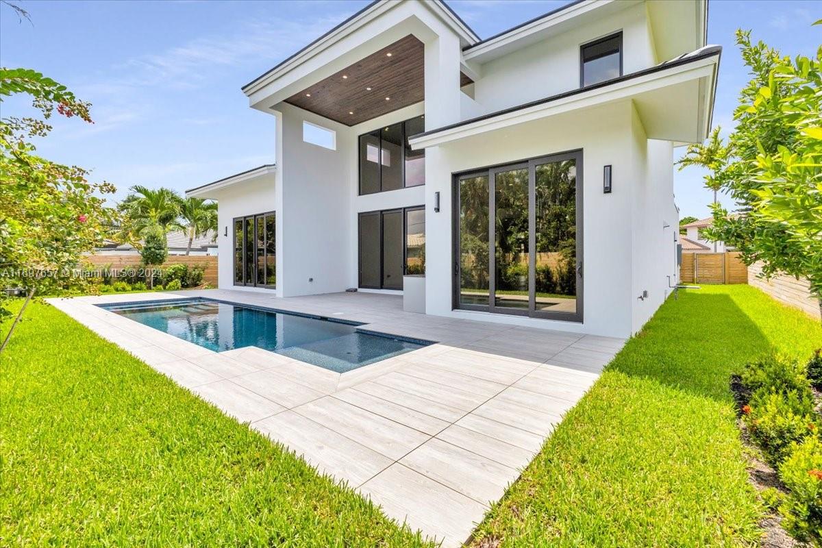 751 Northeast 2nd Street Boca Raton, FL 33432 - Photo 50 of 56 a view of swimming pool with a garden and plants