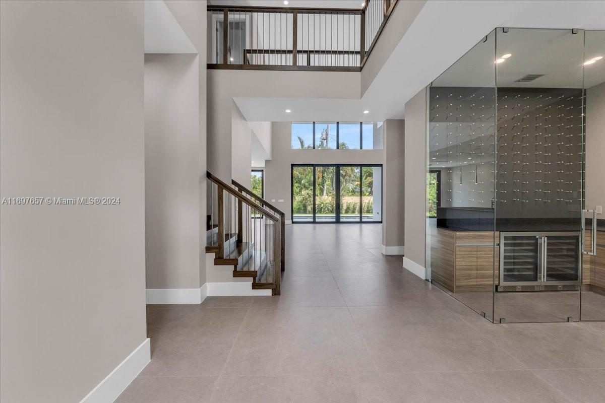 751 Northeast 2nd Street Boca Raton, FL 33432 - Photo 5 of 56 a view of entryway and hall with wooden floor
