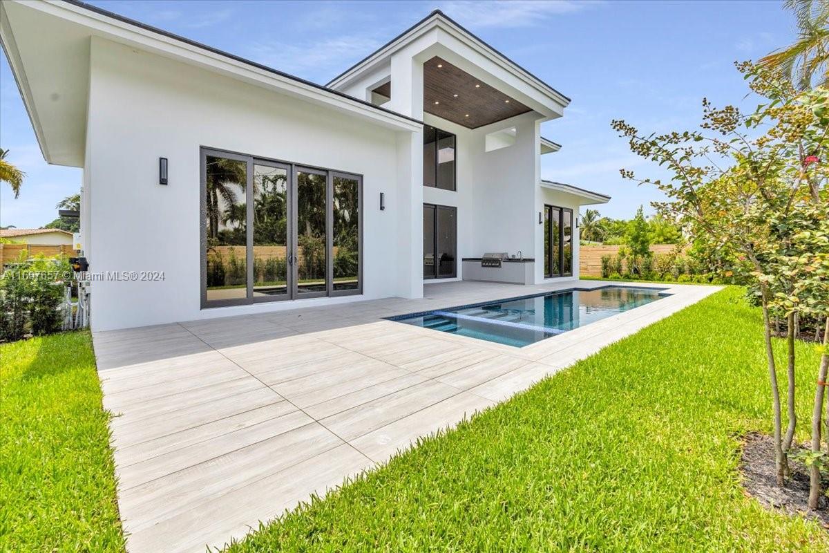 751 Northeast 2nd Street Boca Raton, FL 33432 - Photo 53 of 56 a view of a house with backyard and sitting area