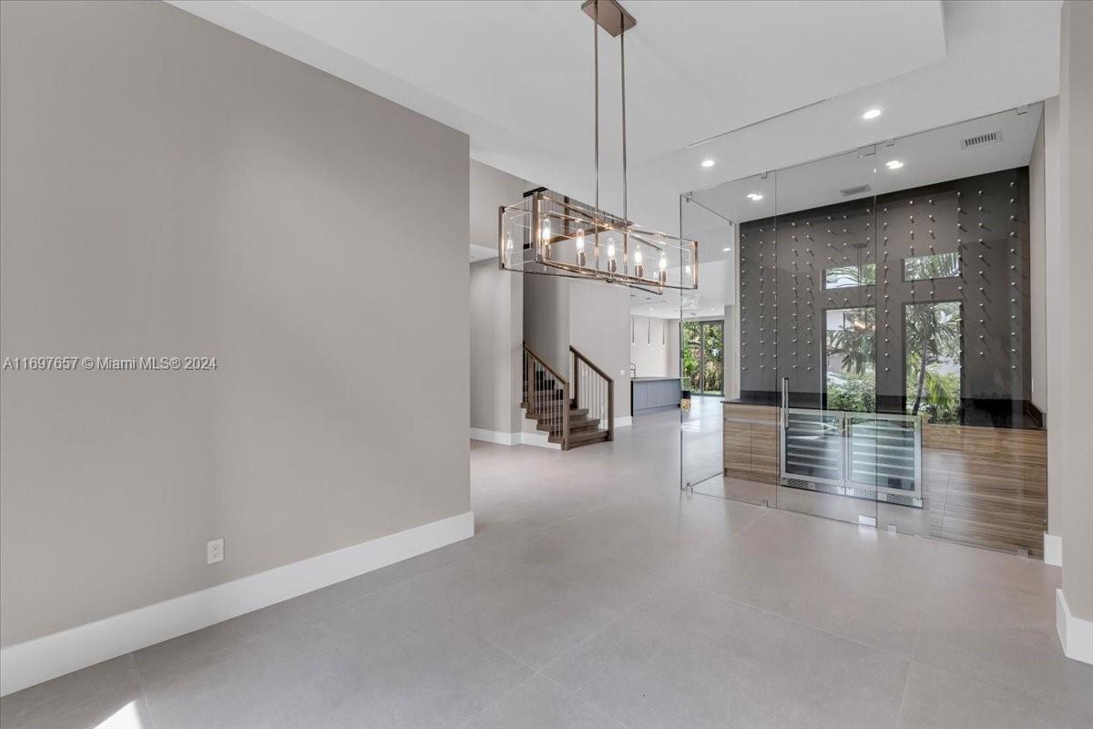 751 Northeast 2nd Street Boca Raton, FL 33432 - Photo 9 of 56 a view of a room with chandelier fan and windows