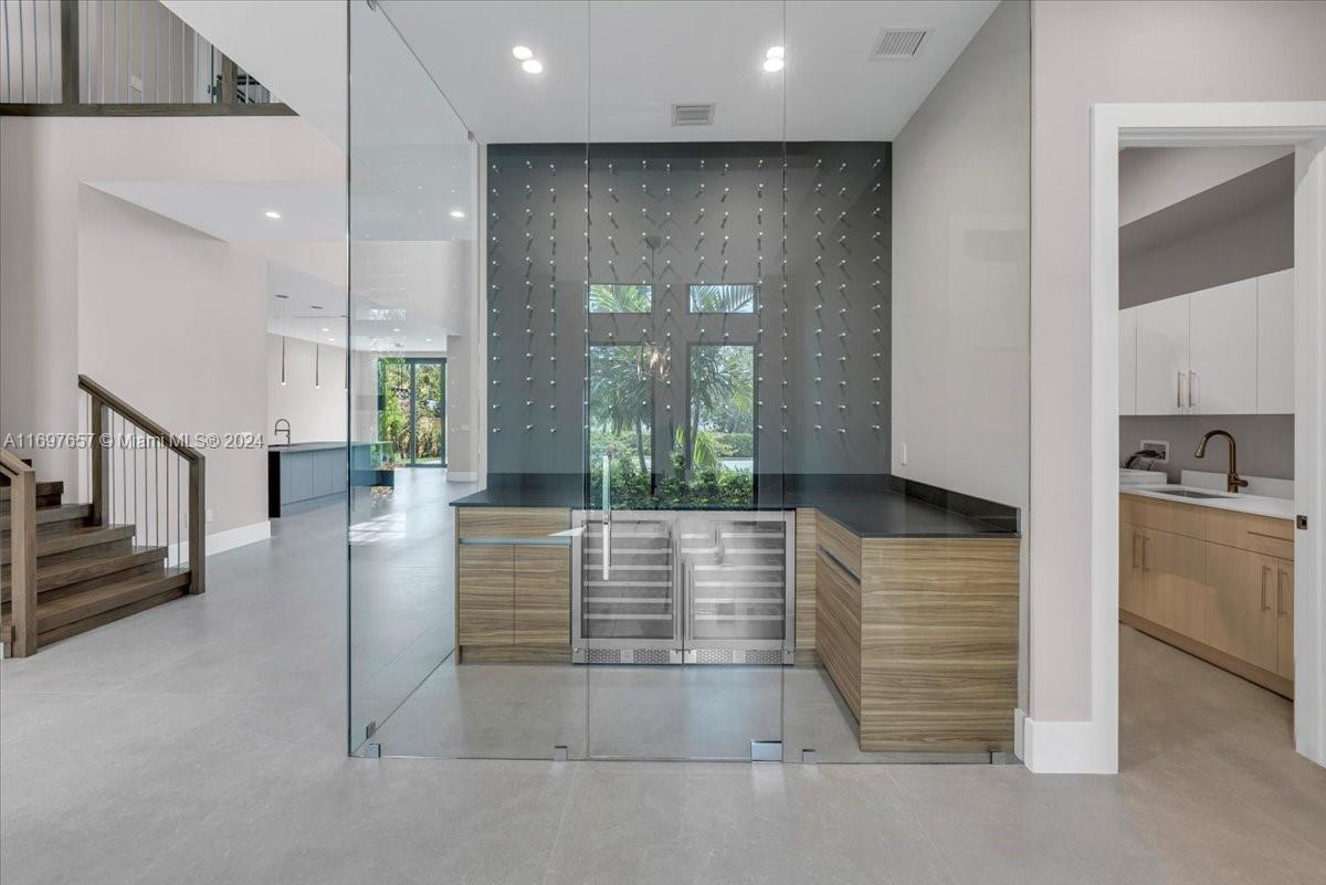 751 Northeast 2nd Street Boca Raton, FL 33432 - Photo 10 of 56 a view of a hallway with entryway wooden floor and front door