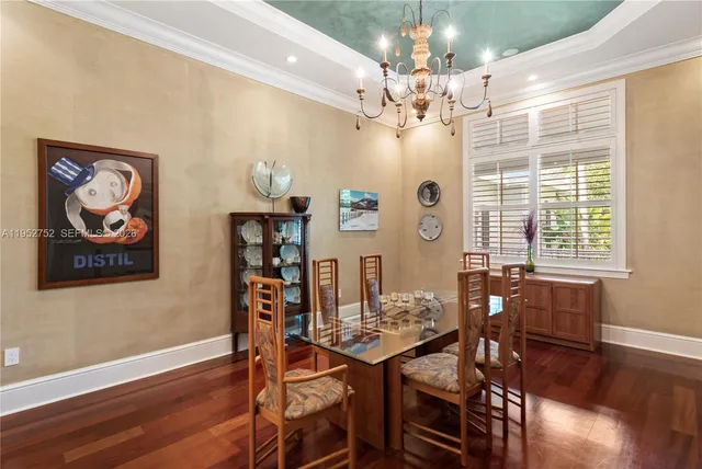a room with pool table and windows