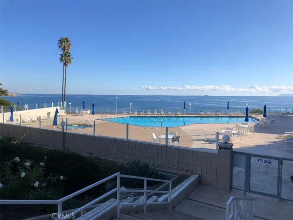 a view of a swimming pool with a lake view