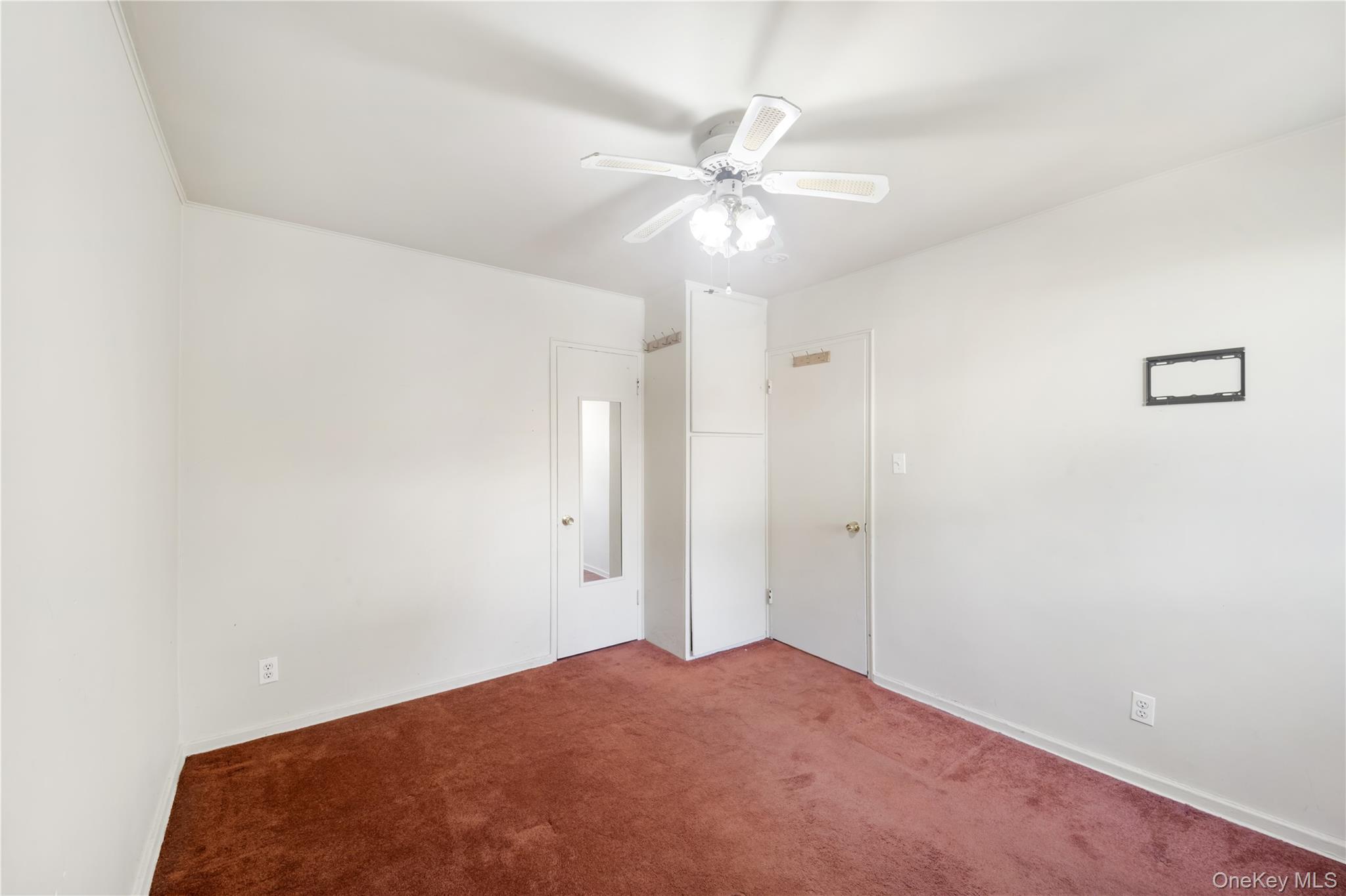 226-29 Manor Road, Unit UPPR Queens, NY 11427 - Photo 16 of 21 Unfurnished bedroom featuring carpet floors and a ceiling fan