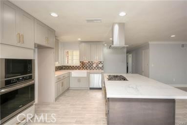 a kitchen with a sink a stove and oven
