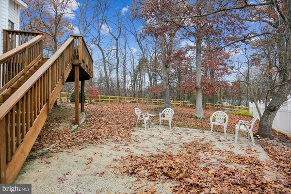a balcony with wooden floor and fence