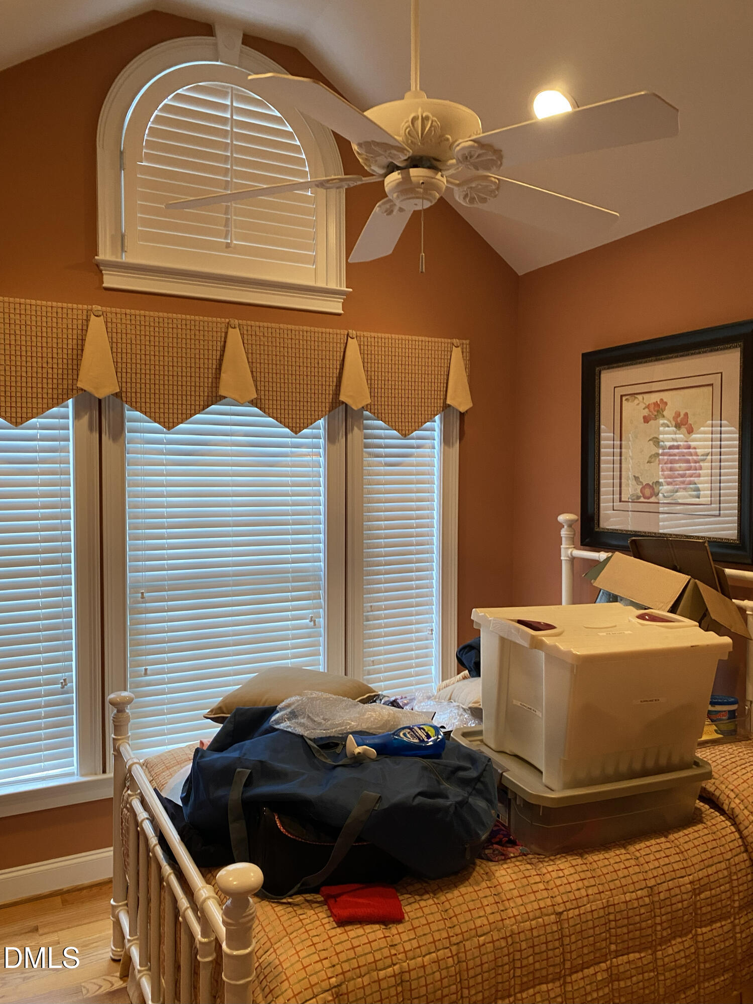 590 Hobson Road Dunn, NC 28334 - Photo 13 of 62 a bedroom with a bed and a chandelier