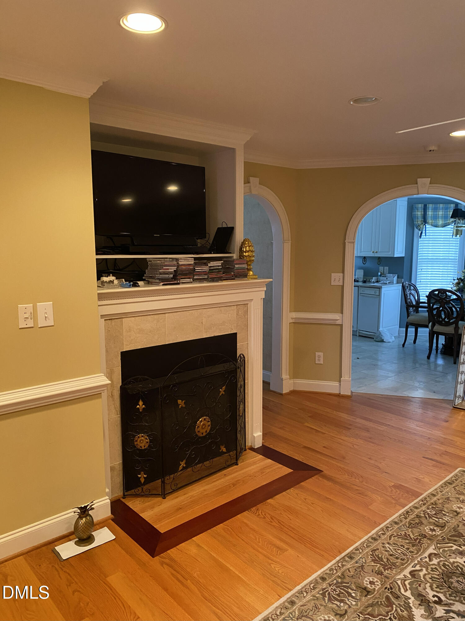 590 Hobson Road Dunn, NC 28334 - Photo 18 of 62 a living room with a fireplace furniture and a flat screen tv