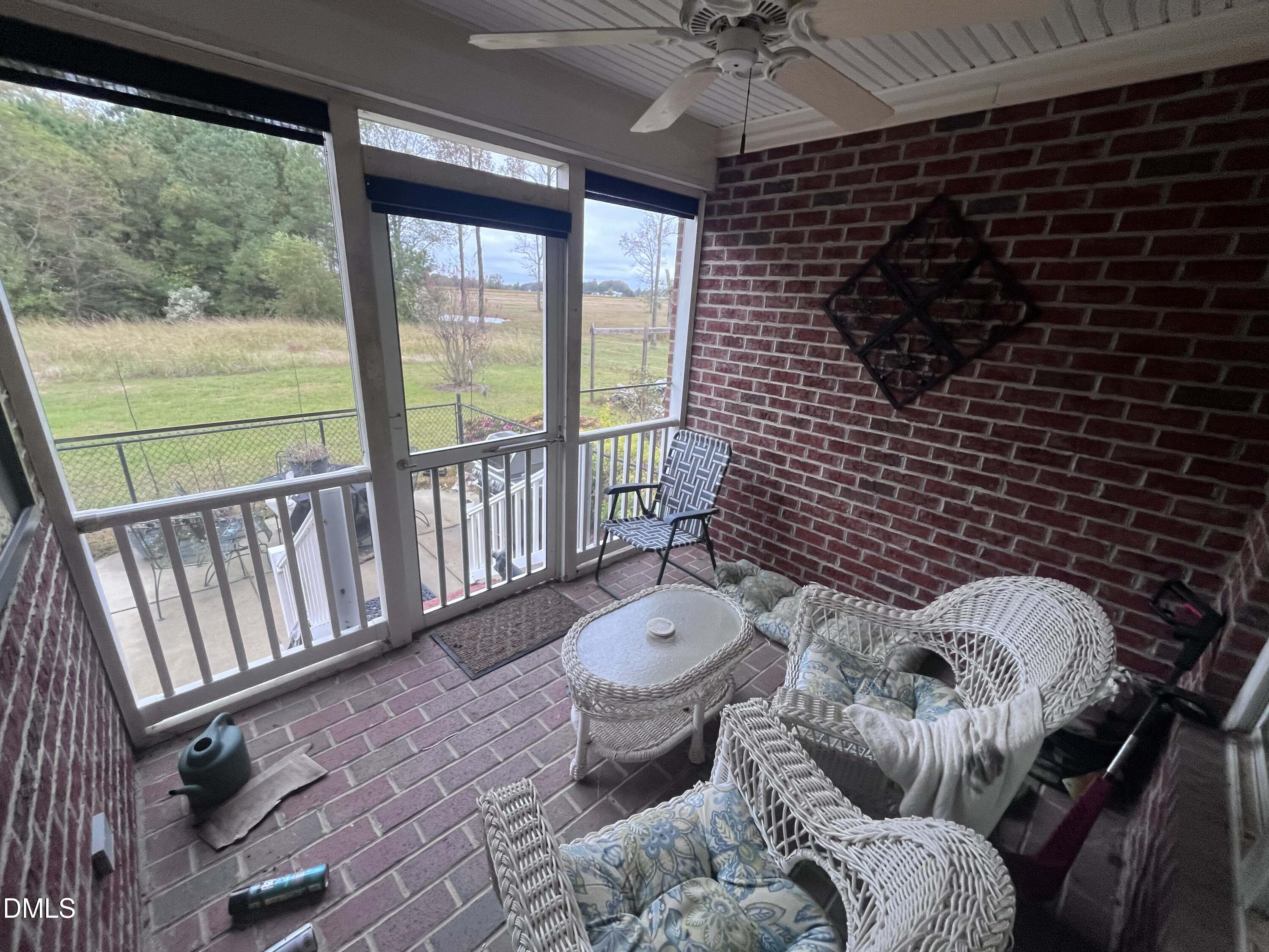 590 Hobson Road Dunn, NC 28334 - Photo 30 of 62 a living room with furniture and a floor to ceiling window