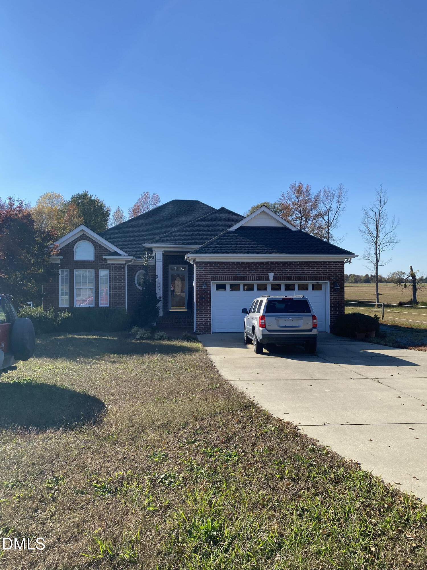 590 Hobson Road Dunn, NC 28334 - Photo 37 of 62 a front view of a house with a yard and garage