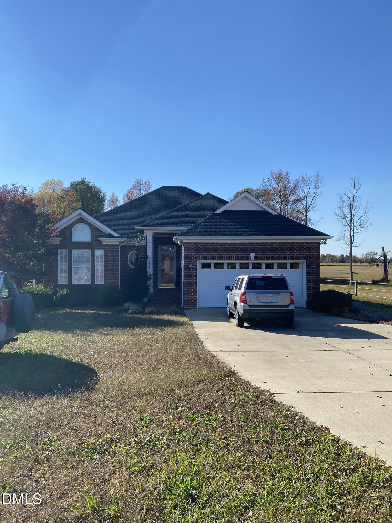 590 Hobson Road Dunn, NC 28334 - Photo 38 of 62 a view of a house with a yard and garage