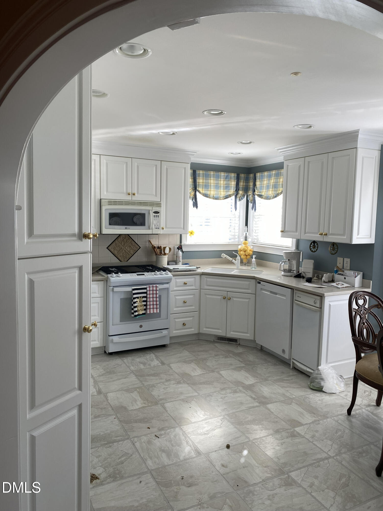 590 Hobson Road Dunn, NC 28334 - Photo 58 of 62 a kitchen with a sink window and cabinets