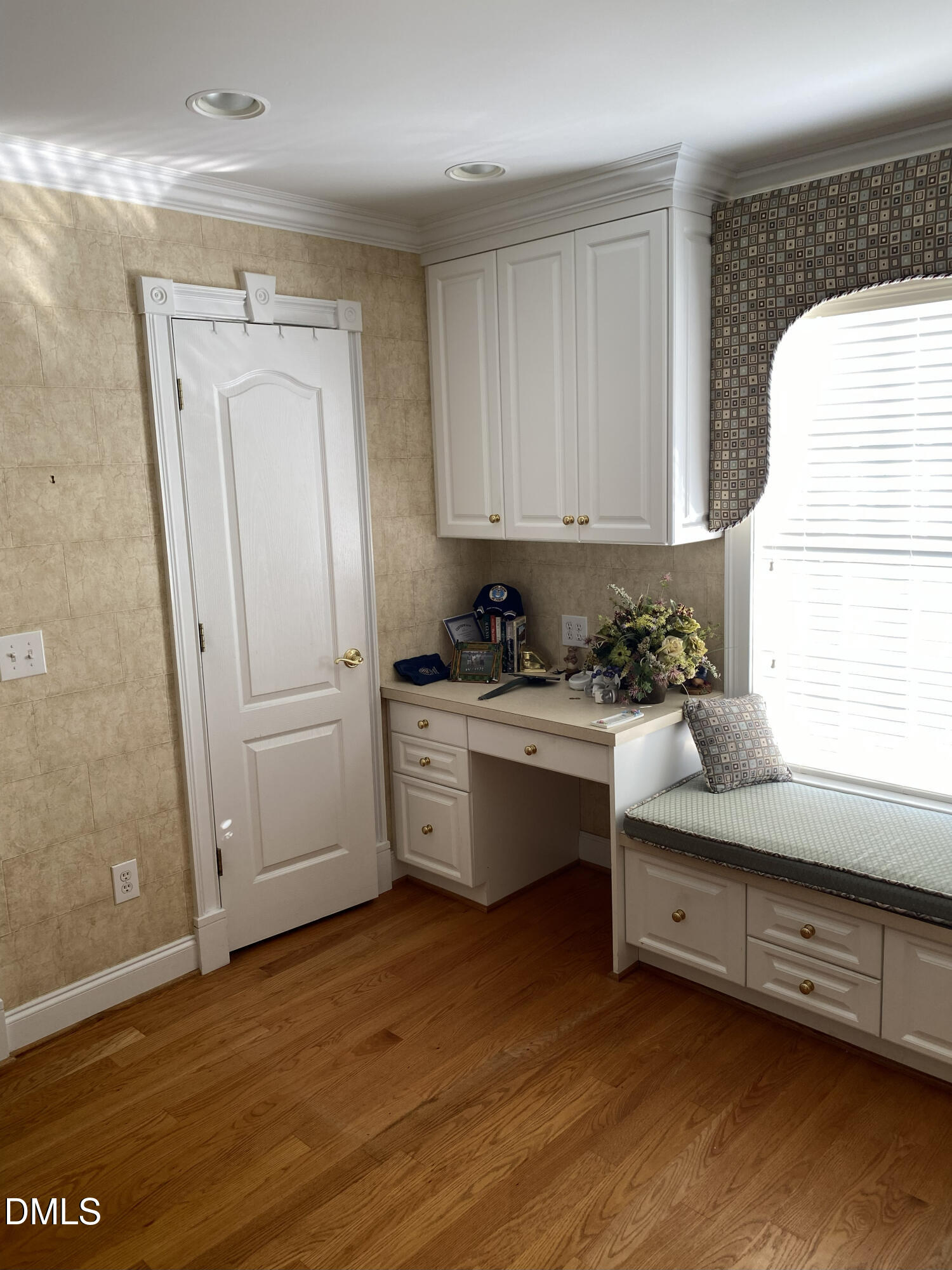 590 Hobson Road Dunn, NC 28334 - Photo 60 of 62 a kitchen with stainless steel appliances white cabinets and wooden floor