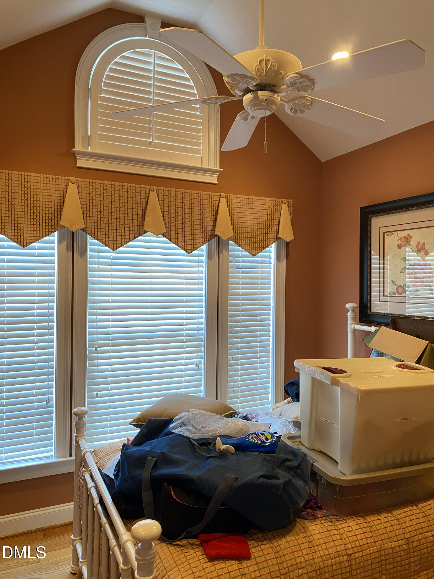 590 Hobson Road Dunn, NC 28334 - Photo 61 of 62 a bedroom with a bed and a chandelier