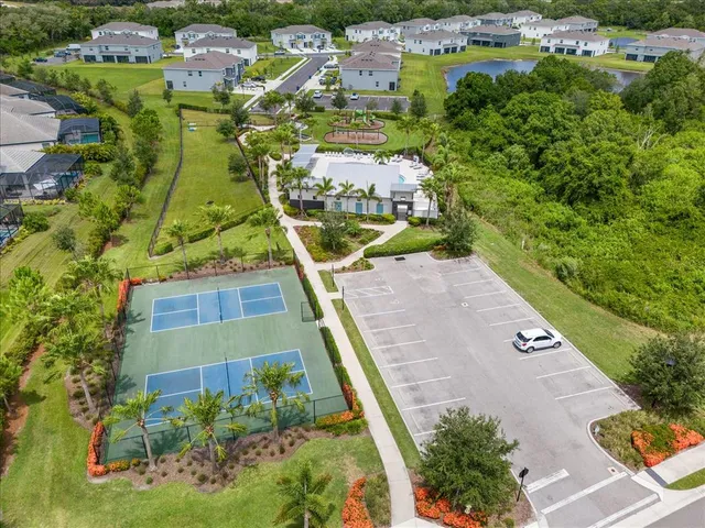 an aerial view of residential houses with outdoor space