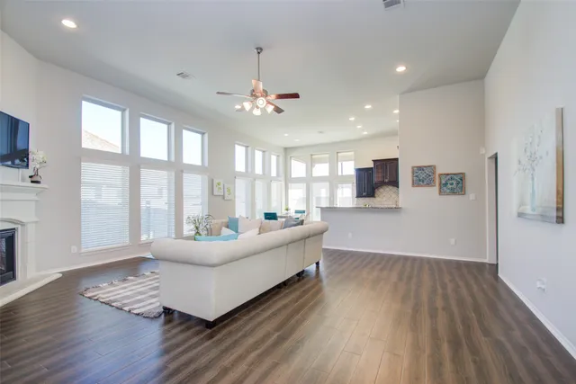 a bathroom with a granite countertop bathtub shower sink and mirror