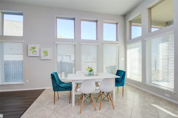 a kitchen with kitchen island granite countertop a sink and a stove