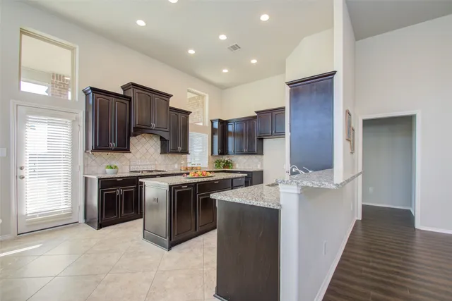 a bathroom with a sink toilet vanity and shower