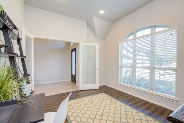 a bedroom with windows