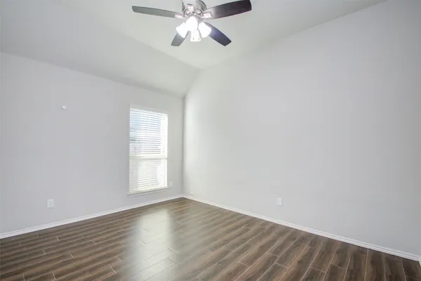 a bathroom with a granite countertop sink a mirror and vanity