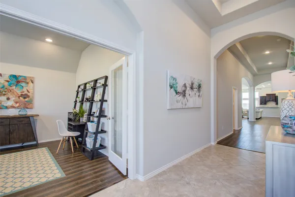a view of a livingroom with furniture and workspace