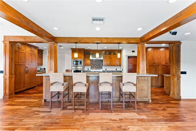 a dining room with furniture and wooden floor