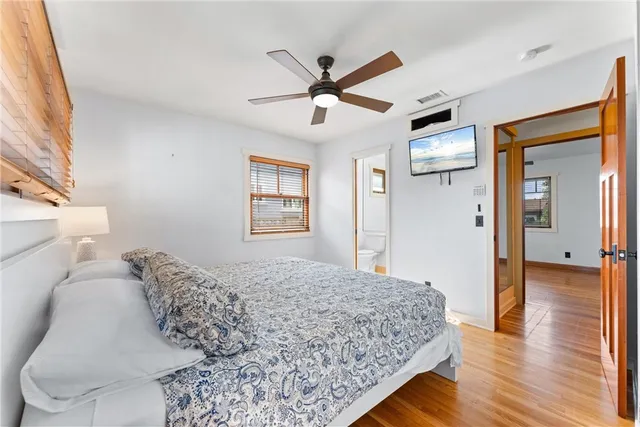 a living room with a bed furniture and a window