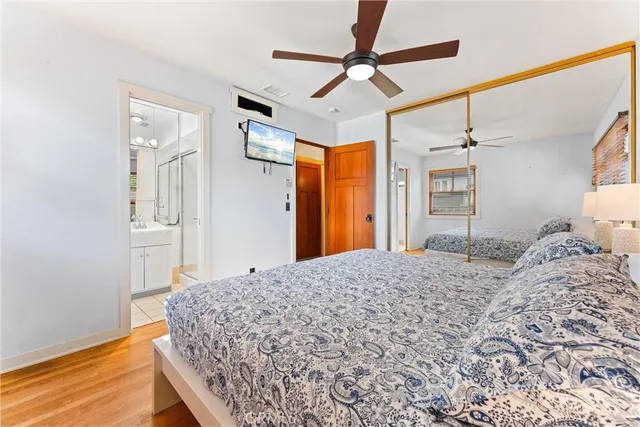 a bedroom with a bed and a dresser