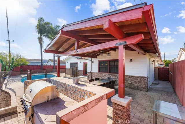 a view of a backyard with sitting area and furniture