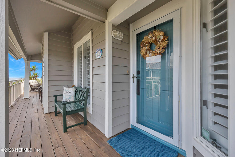 a view of front door deck and dining room