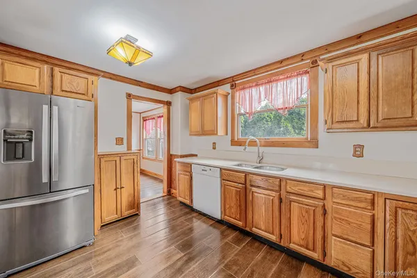 a kitchen with stainless steel appliances granite countertop a refrigerator and a stove top oven