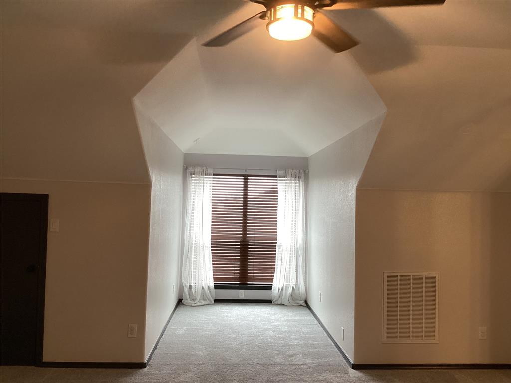 10320 Point Lobos Trail Fort Worth, TX 76177 - Photo 25 of 33 Carpeted room with a central window, featuring horizontal blinds and sheer drapes