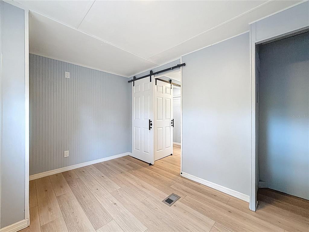 9569 Gray Fox Drive Weeki Wachee, FL 34613 - Photo 14 of 27 wooden floor in an empty room