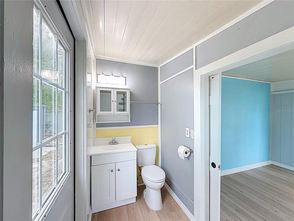 9569 Gray Fox Drive Weeki Wachee, FL 34613 - Photo 16 of 27 a bathroom with a tub shower and a sink