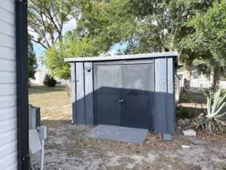 9569 Gray Fox Drive Weeki Wachee, FL 34613 - Photo 25 of 27 a view of backyard with large tree