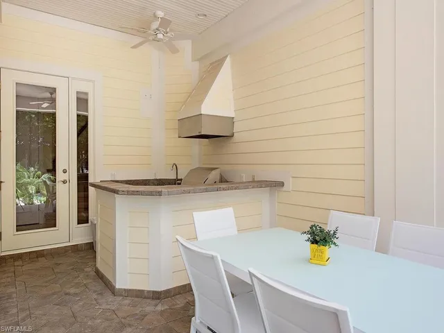 a kitchen with a sink and a stove top oven