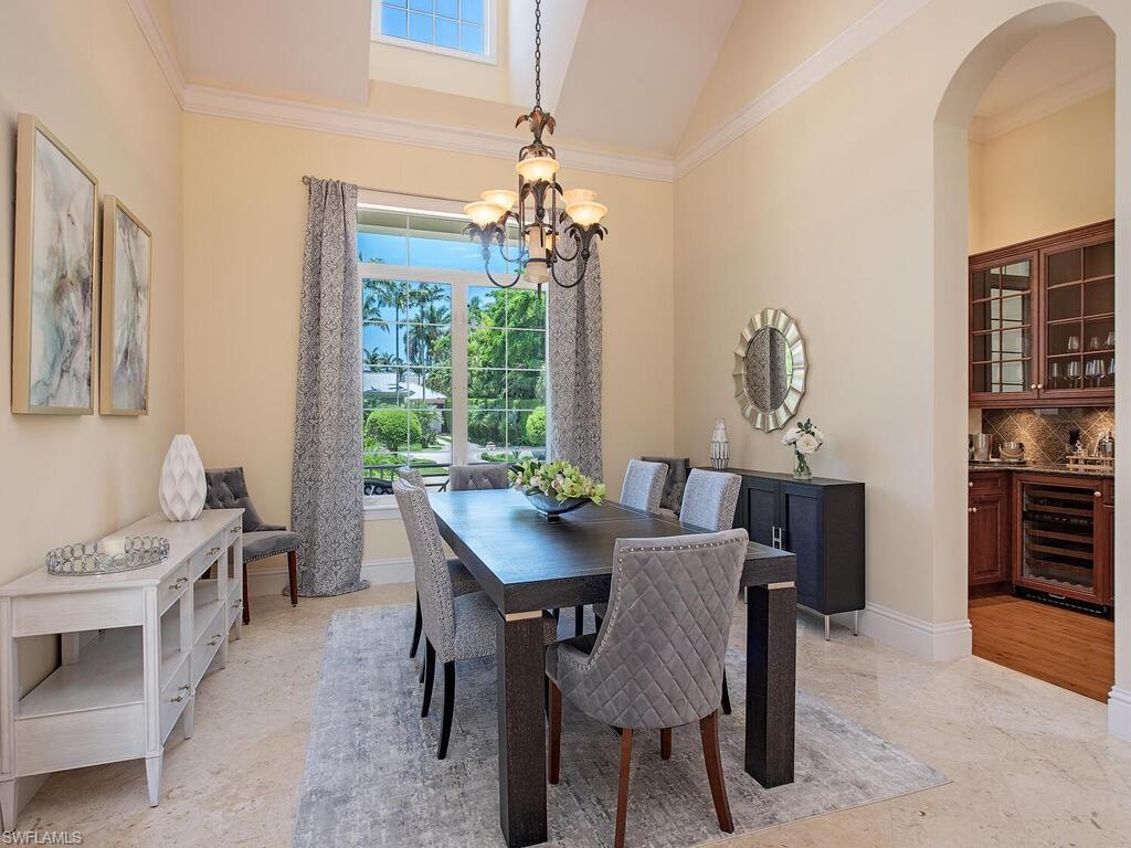 194 4th Avenue North Naples, FL 34102 - Photo 21 of 37 a view of a dining room with furniture window and outside view