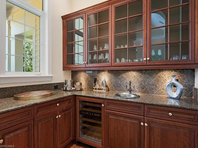 a kitchen with granite countertop a oven and cabinets