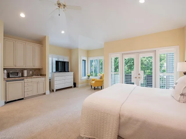 a bed room with a bed and a view of en suite bathroom