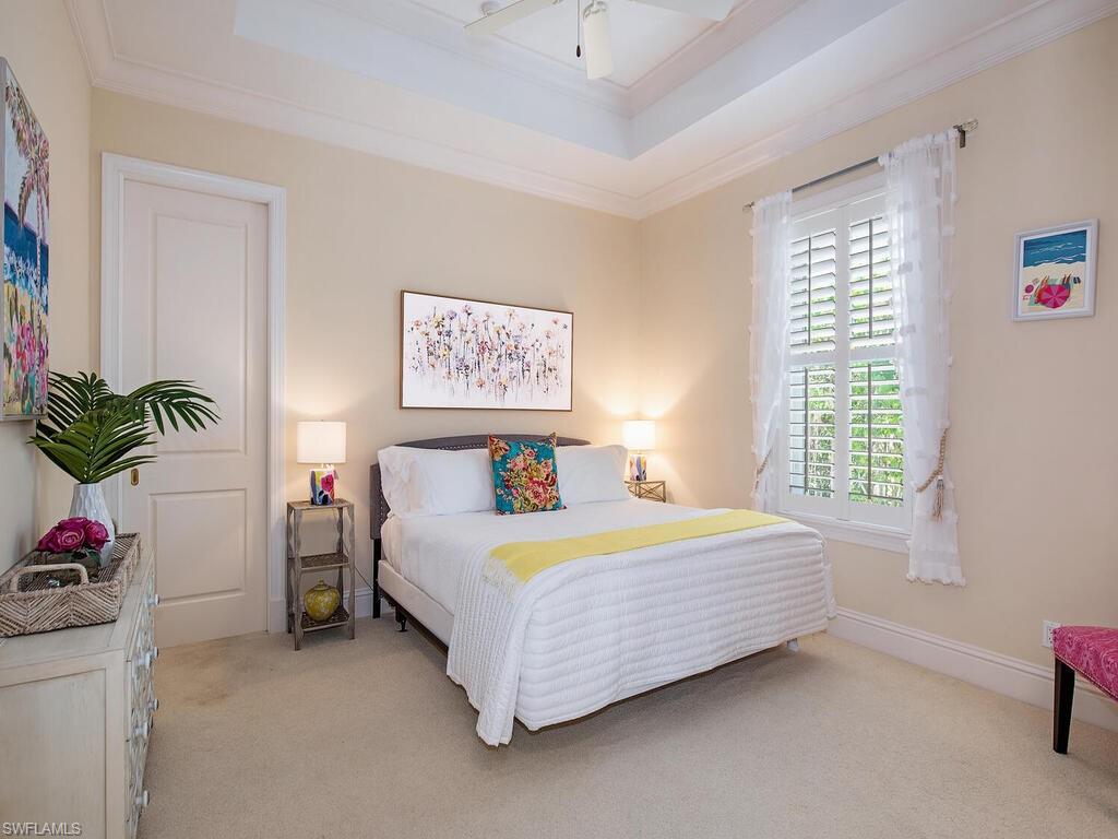194 4th Avenue North Naples, FL 34102 - Photo 30 of 37 a bedroom with a bed and a window