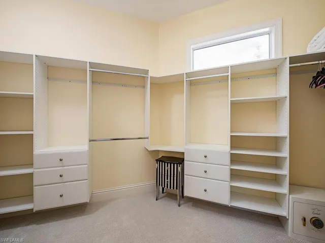 a view of an empty walk in closet
