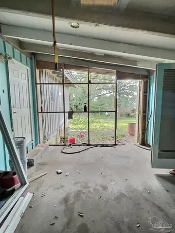 a view of a room with large windows