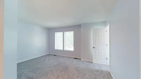 an empty room with windows