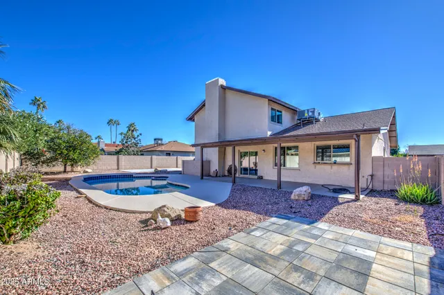 a bedroom with a bed and cabinets