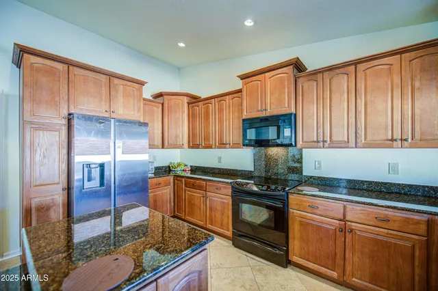 a living room with furniture a dining table and a fireplace
