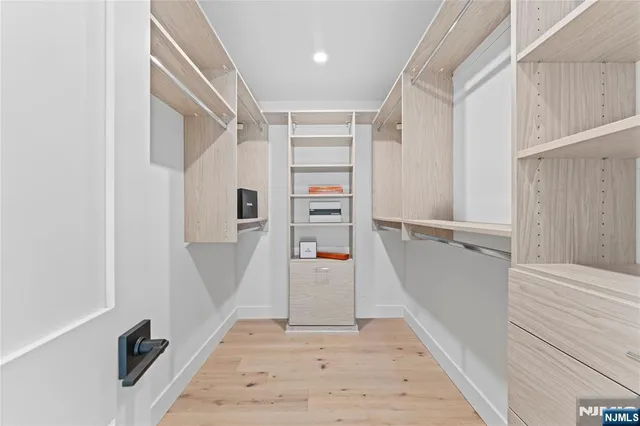 a bathroom with a toilet a sink and vanity