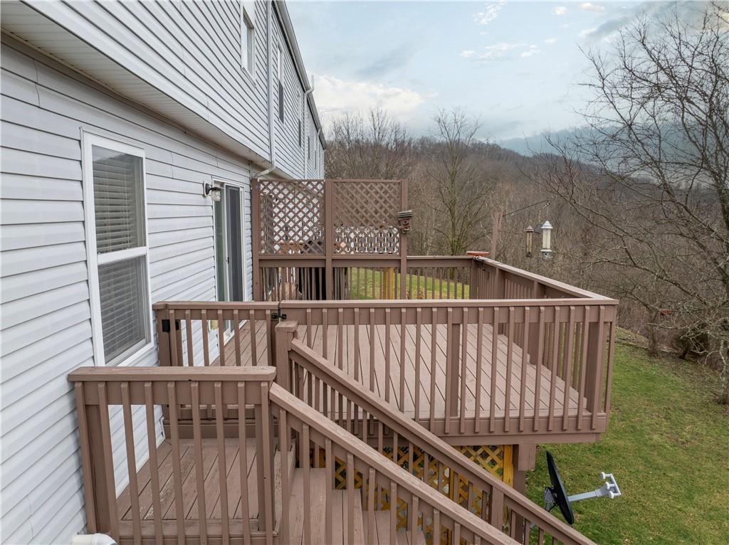 2008 Arbor Ridge Court Cheswick, PA 15024 - Photo 21 of 26 Most of the units in the plan have just a balcony, this unit boasts a full size deck with stairs leading to the back. The view is breathtaking.