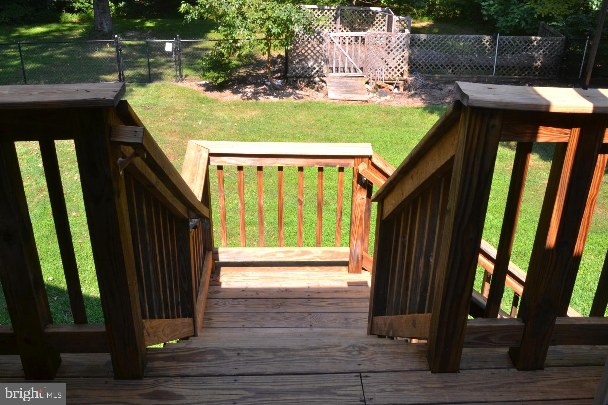 9185 Nana Russell Road Owings, MD 20736 - Photo 14 of 30 Deck stairs to back yard